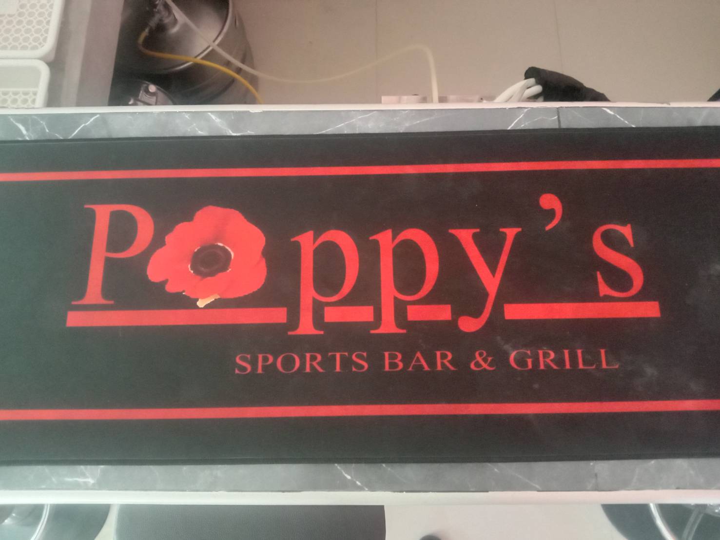 Poppy's bar sign