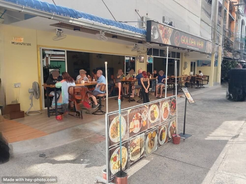 Golden view, guesthouse, restaurant and bar in Jomtien Pattaya, sideview full of guests on the terras